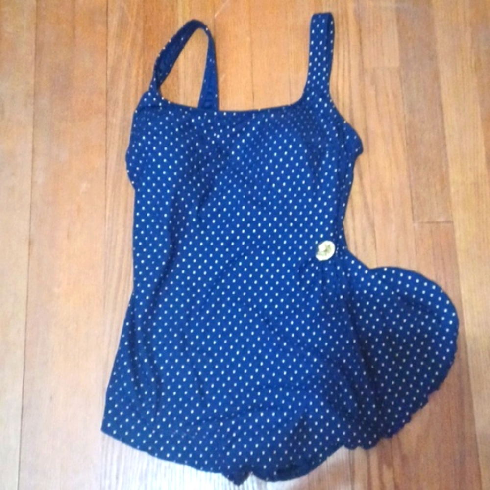 Longitude one pc.size 10 navy & gold dot suit with front skirt.  Ballet back.
